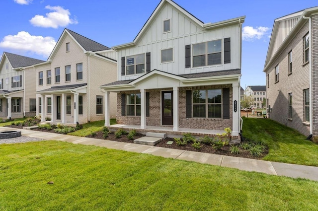 2615 Wilkinson Pike Unit 7A, Murfreesboro, TN 37129 - multi unit property featuring board and batten siding, covered porch, brick siding, and a front yard