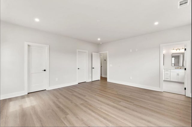 2615 Wilkinson Pike Unit 7A, Murfreesboro, TN 37129 - unfurnished bedroom featuring light wood finished floors, recessed lighting, and ensuite bath