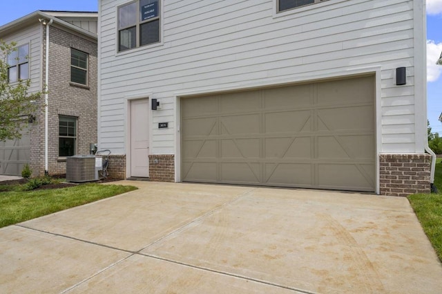 2615 Wilkinson Pike Unit 7A, Murfreesboro, TN 37129 - view of front of house with a garage, driveway, and brick siding