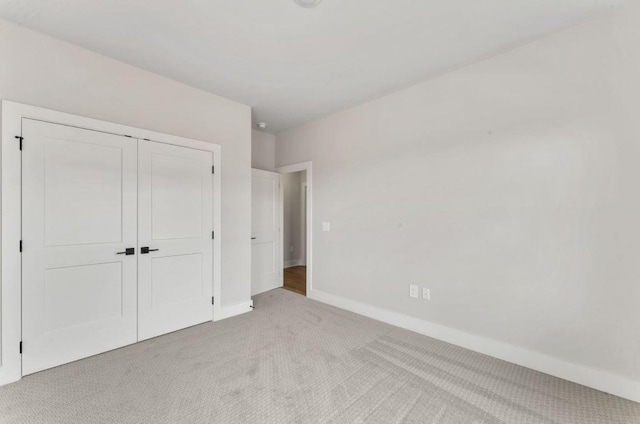 2615 Wilkinson Pike Unit 7A, Murfreesboro, TN 37129 - unfurnished bedroom featuring light carpet and a closet