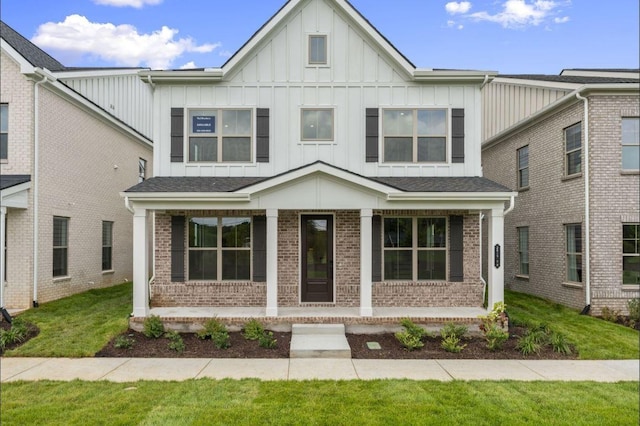 2615 Wilkinson Pike Unit 7A, Murfreesboro, TN 37129 - view of front facade featuring a porch, brick siding, board and batten siding, and a front lawn