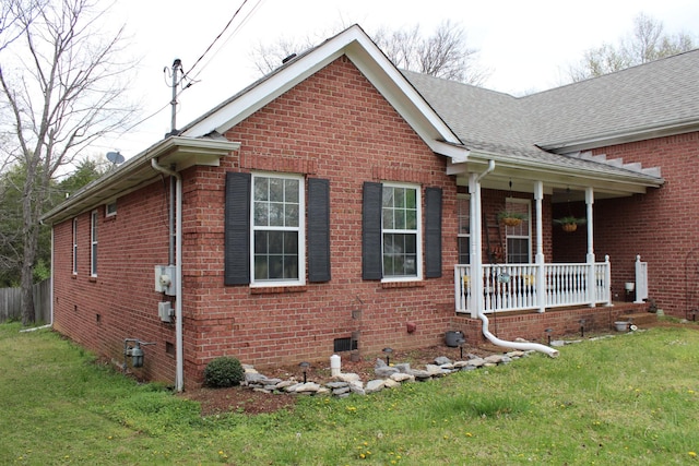 6309 Paddington Way, Antioch, TN 37013 - view of side of property with crawl space, a yard, covered porch, roof with shingles, and brick siding