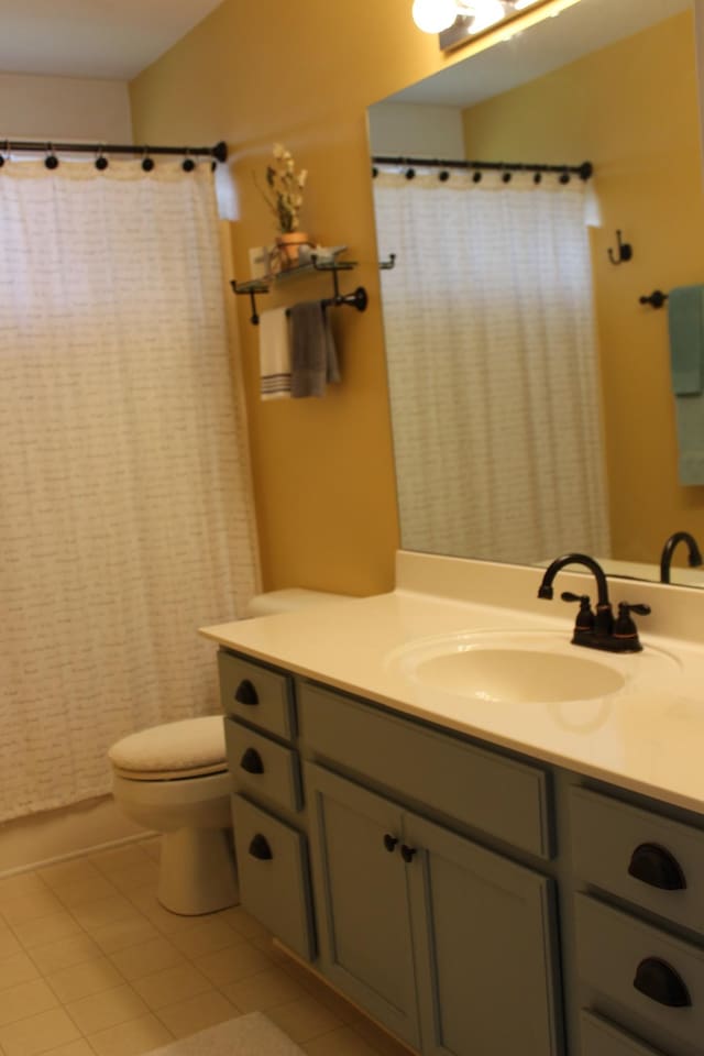 6309 Paddington Way, Antioch, TN 37013 - bathroom with tile patterned floors, vanity, and toilet