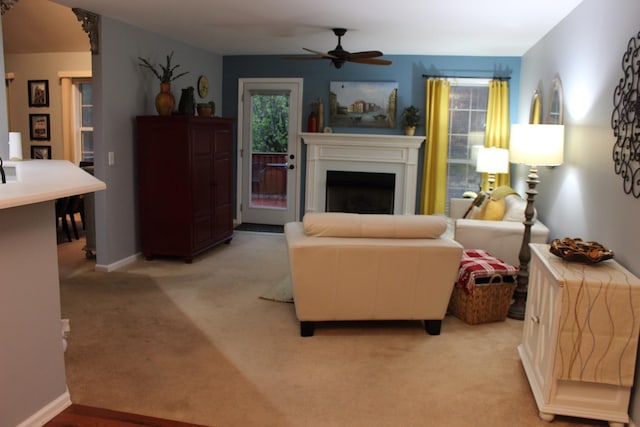 6309 Paddington Way, Antioch, TN 37013 - living room with ceiling fan, baseboards, light carpet, and a fireplace