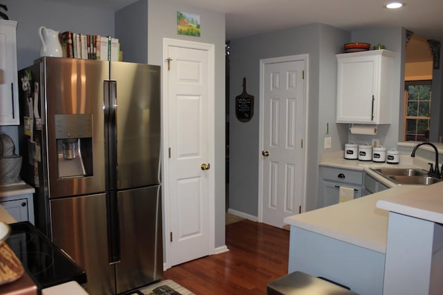 6309 Paddington Way, Antioch, TN 37013 - kitchen featuring stainless steel fridge with ice dispenser, white cabinets, a sink, light countertops, and dark wood finished floors