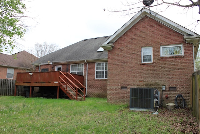 6309 Paddington Way, Antioch, TN 37013 - rear view of property with a wooden deck, a lawn, fence, brick siding, and central AC unit