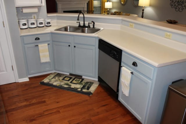 6309 Paddington Way, Antioch, TN 37013 - kitchen featuring a sink, light countertops, stainless steel dishwasher, and dark wood-type flooring