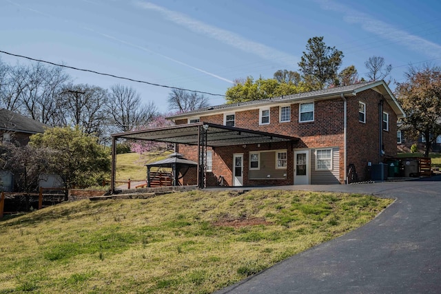 6004 Hawkdale Dr, Nashville, TN 37211 - view of front of home with driveway, a gazebo, a front lawn, brick siding, and central AC