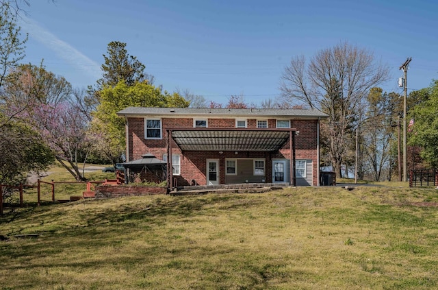6004 Hawkdale Dr, Nashville, TN 37211 - back of property featuring brick siding and a lawn