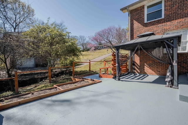 6004 Hawkdale Dr, Nashville, TN 37211 - view of patio with a gazebo, fence, and a vegetable garden