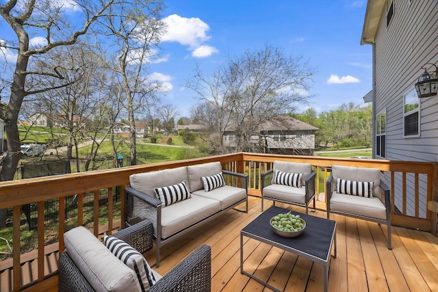wooden deck with an outdoor hangout area