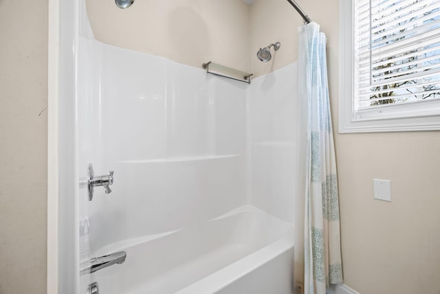 bathroom featuring shower / tub combo with curtain