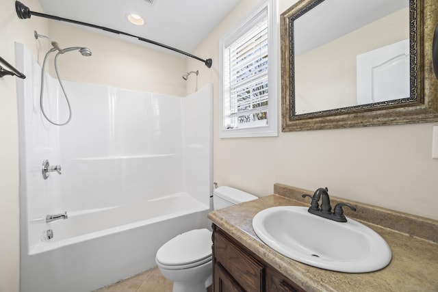 full bathroom featuring tile patterned floors, toilet, vanity, and shower / bathtub combination