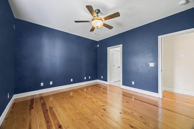 unfurnished bedroom featuring baseboards, ceiling fan, and wood-type flooring