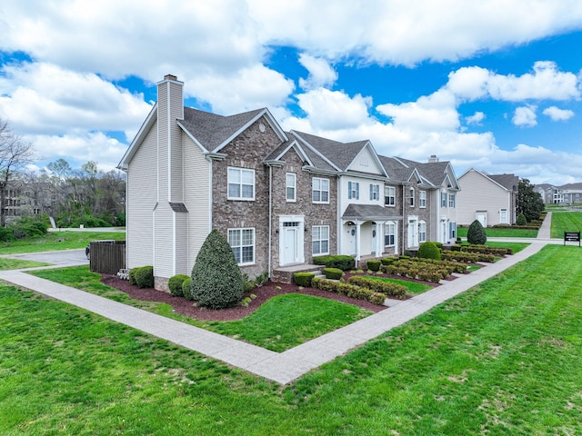 multi unit property with a chimney, a residential view, and a front lawn