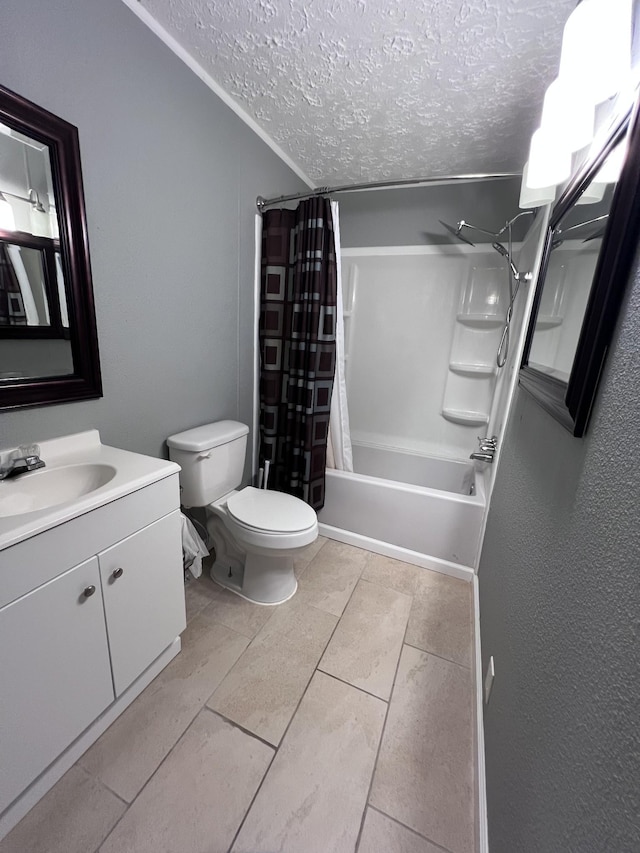 bathroom featuring shower / tub combo with curtain, a textured ceiling, toilet, and vanity