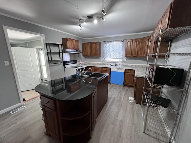 kitchen featuring under cabinet range hood, open shelves, dishwashing machine, visible vents, and white range with electric cooktop