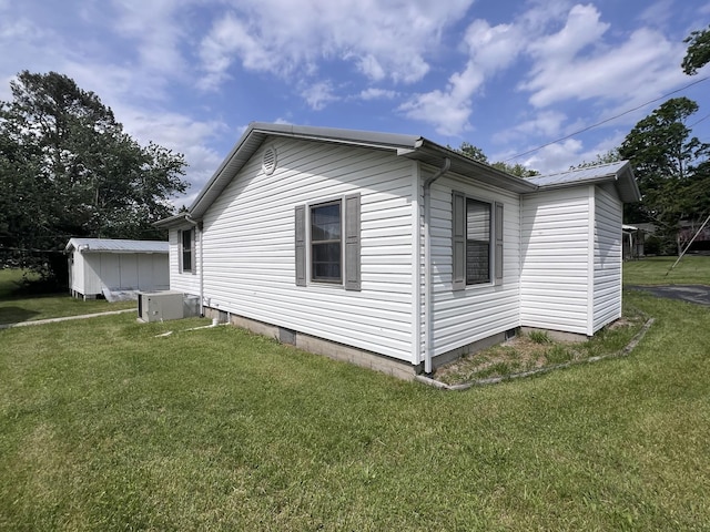31 Marler St, Tracy City, TN 37387 - view of home's exterior with a lawn, crawl space, and an outdoor structure