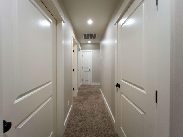 corridor with baseboards, visible vents, carpet floors, and recessed lighting