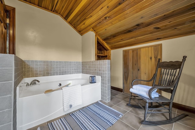 bathroom with tile patterned flooring, lofted ceiling, baseboards, wood ceiling, and a bath