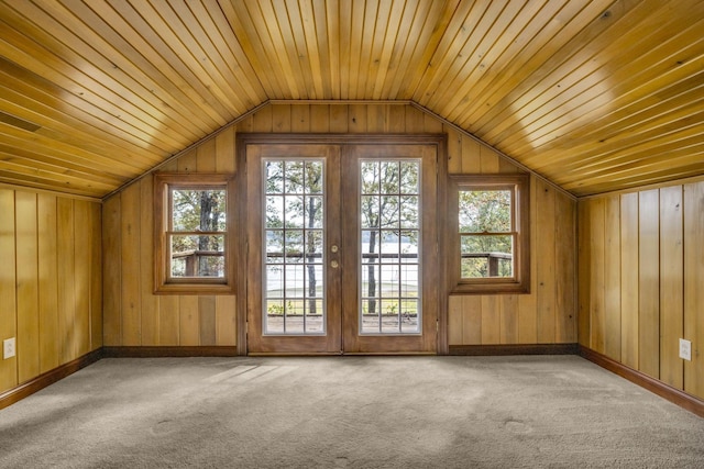 additional living space featuring carpet flooring, wooden ceiling, and vaulted ceiling