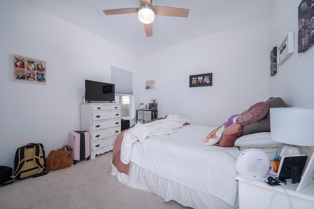 bedroom with a ceiling fan and carpet