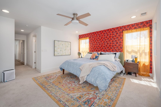 bedroom featuring light carpet, baseboards, recessed lighting, and a ceiling fan