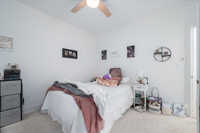 carpeted bedroom with a ceiling fan
