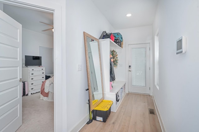 mudroom featuring baseboards, light wood-style flooring, and a ceiling fan