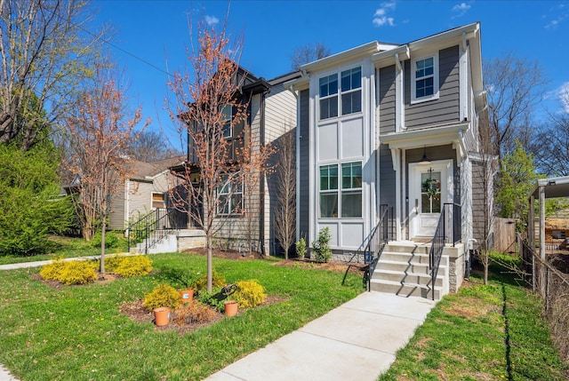 traditional-style home featuring a front yard