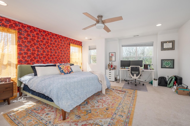 bedroom featuring a ceiling fan, carpet, multiple windows, and recessed lighting