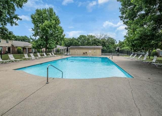 pool featuring fence and a patio