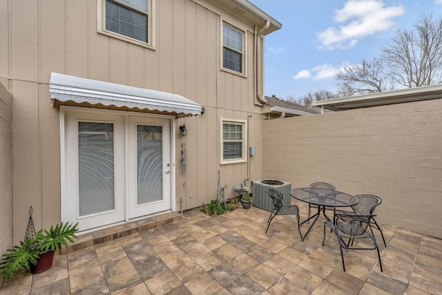 exterior space featuring central AC unit, outdoor dining space, and a patio area