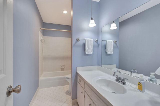 full bathroom with tile patterned floors, toilet, vanity, washtub / shower combination, and baseboards