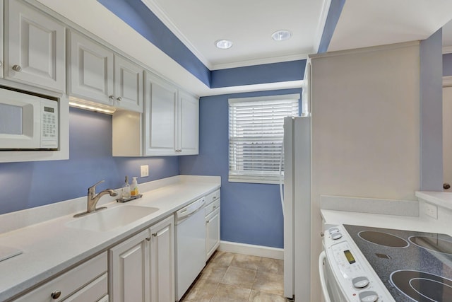 kitchen featuring light tile patterned flooring, light countertops, crown molding, white appliances, and a sink