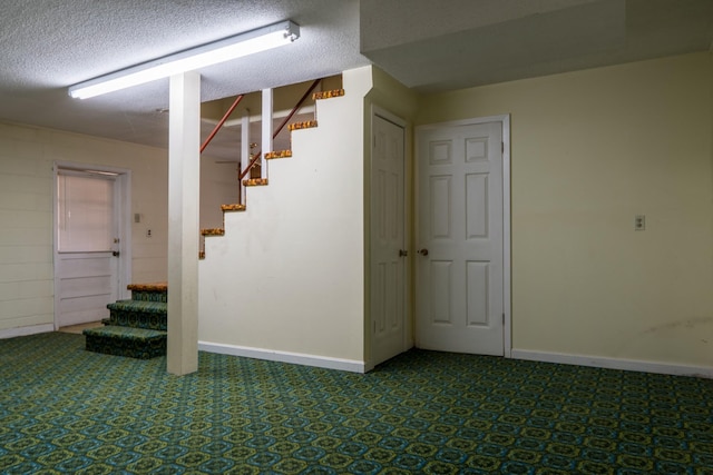 2589 Presley Ridge Rd, Sardis, TN 38371 - finished below grade area featuring baseboards, stairs, and a textured ceiling