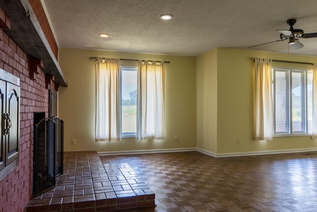 2589 Presley Ridge Rd, Sardis, TN 38371 - unfurnished living room with a textured ceiling, baseboards, a fireplace, ceiling fan, and recessed lighting
