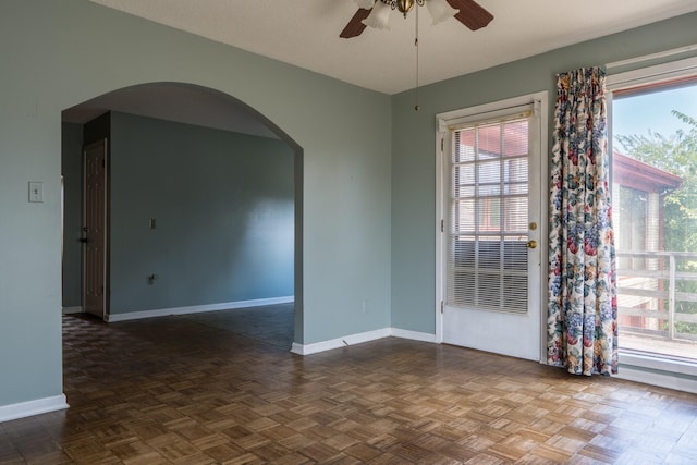 2589 Presley Ridge Rd, Sardis, TN 38371 - spare room with arched walkways, ceiling fan, baseboards, and plenty of natural light