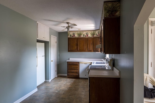 2589 Presley Ridge Rd, Sardis, TN 38371 - kitchen with built in study area, under cabinet range hood, baseboards, white appliances, and ceiling fan