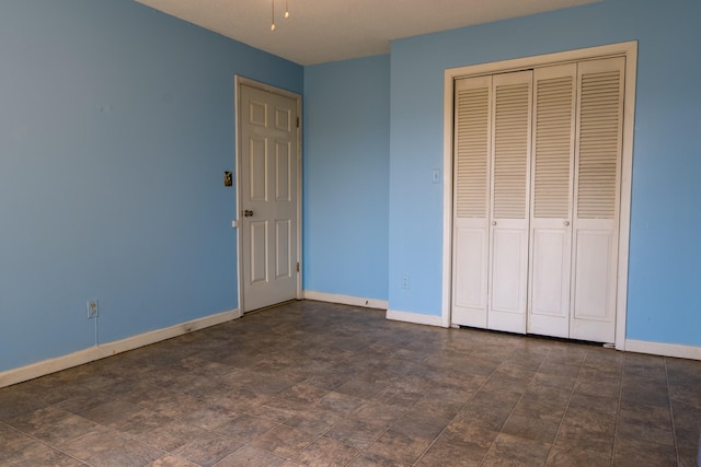 2589 Presley Ridge Rd, Sardis, TN 38371 - unfurnished bedroom with a closet and baseboards