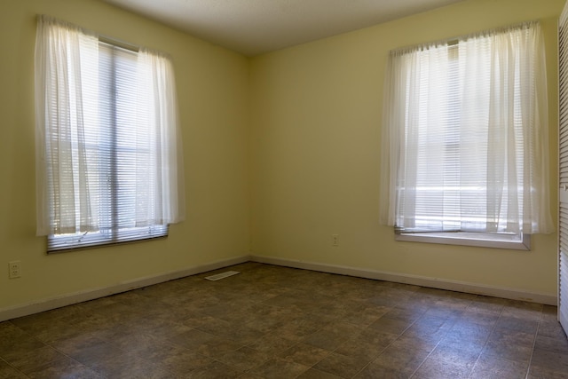 2589 Presley Ridge Rd, Sardis, TN 38371 - empty room with baseboards, a healthy amount of sunlight, and visible vents