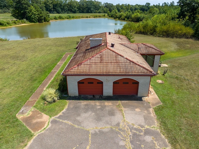 2589 Presley Ridge Rd, Sardis, TN 38371 - view of front of home featuring a tile roof, a front yard, a water view, and brick siding