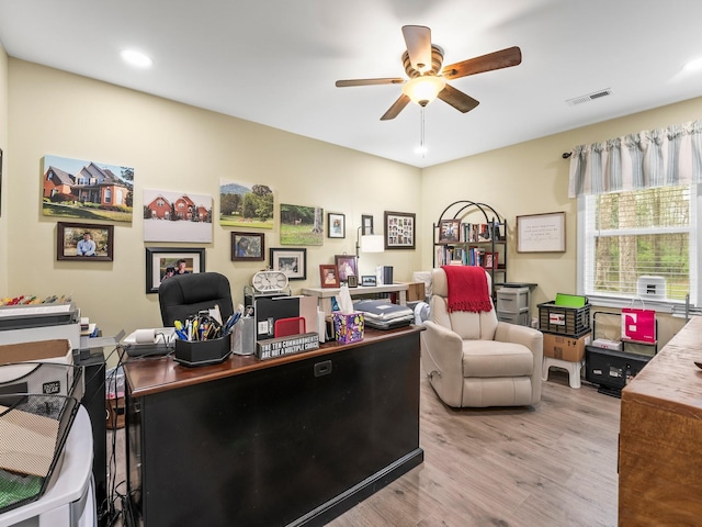 office space featuring visible vents, light wood-style floors, recessed lighting, and a ceiling fan