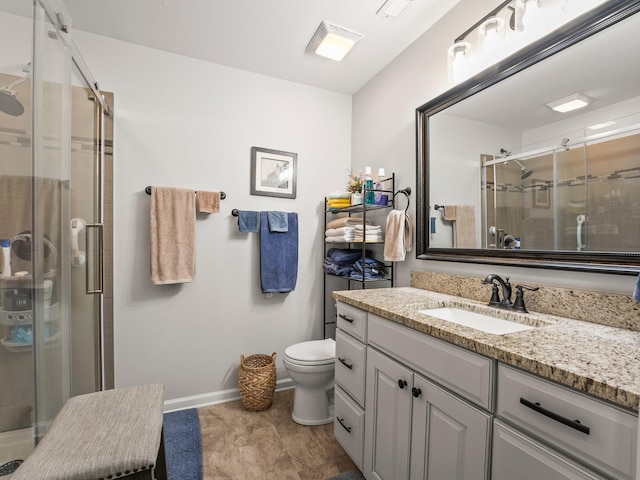 full bathroom with toilet, vanity, baseboards, and a shower stall
