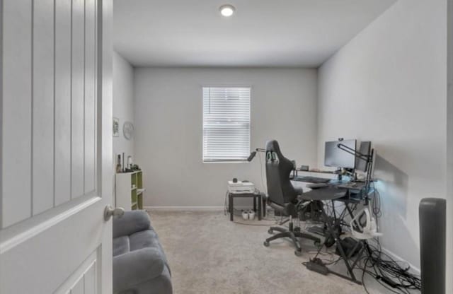 home office featuring baseboards and carpet flooring