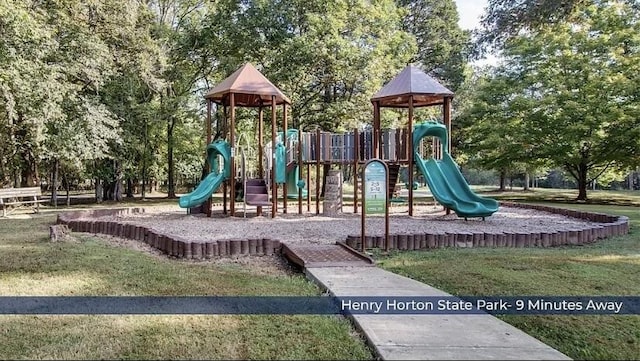 community play area featuring a lawn