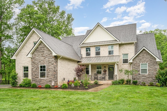 4902 Charles Dorris Rd, Springfield, TN 37172 - craftsman-style house featuring stone siding, covered porch, a shingled roof, and a front lawn