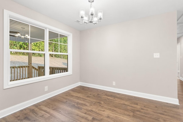 28 Gratton Ests, Clarksville, TN 37043 - spare room with baseboards, wood finished floors, and a chandelier