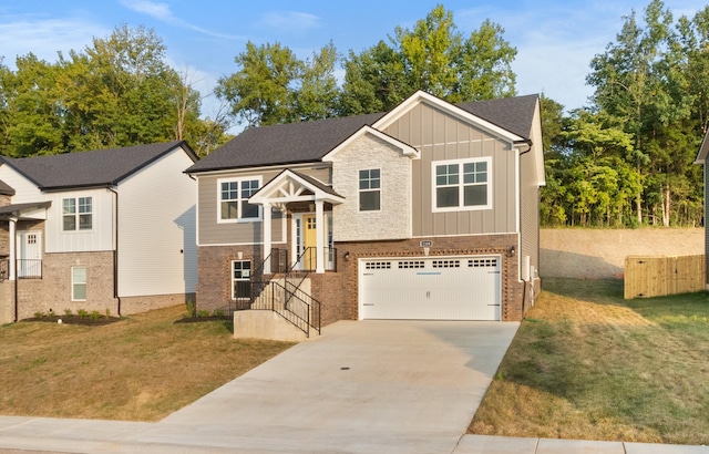 28 Gratton Ests, Clarksville, TN 37043 - bi-level home featuring an attached garage, brick siding, concrete driveway, and board and batten siding