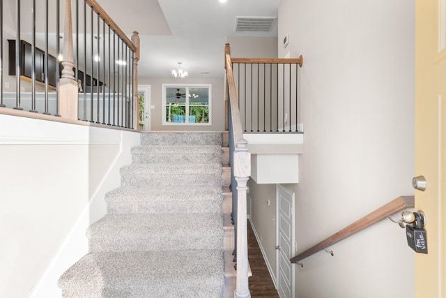 28 Gratton Ests, Clarksville, TN 37043 - stairway featuring wood finished floors, a chandelier, and visible vents